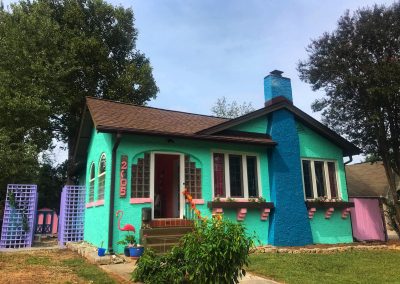 neon colored home with a brand new roof replacement