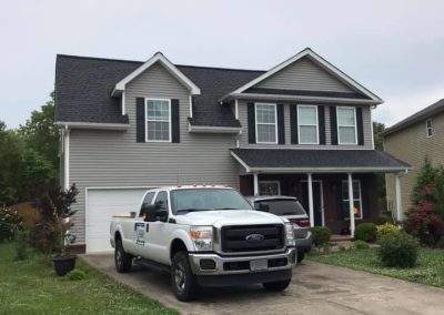 three level home in knoxville with grey siding and charcoal roofing